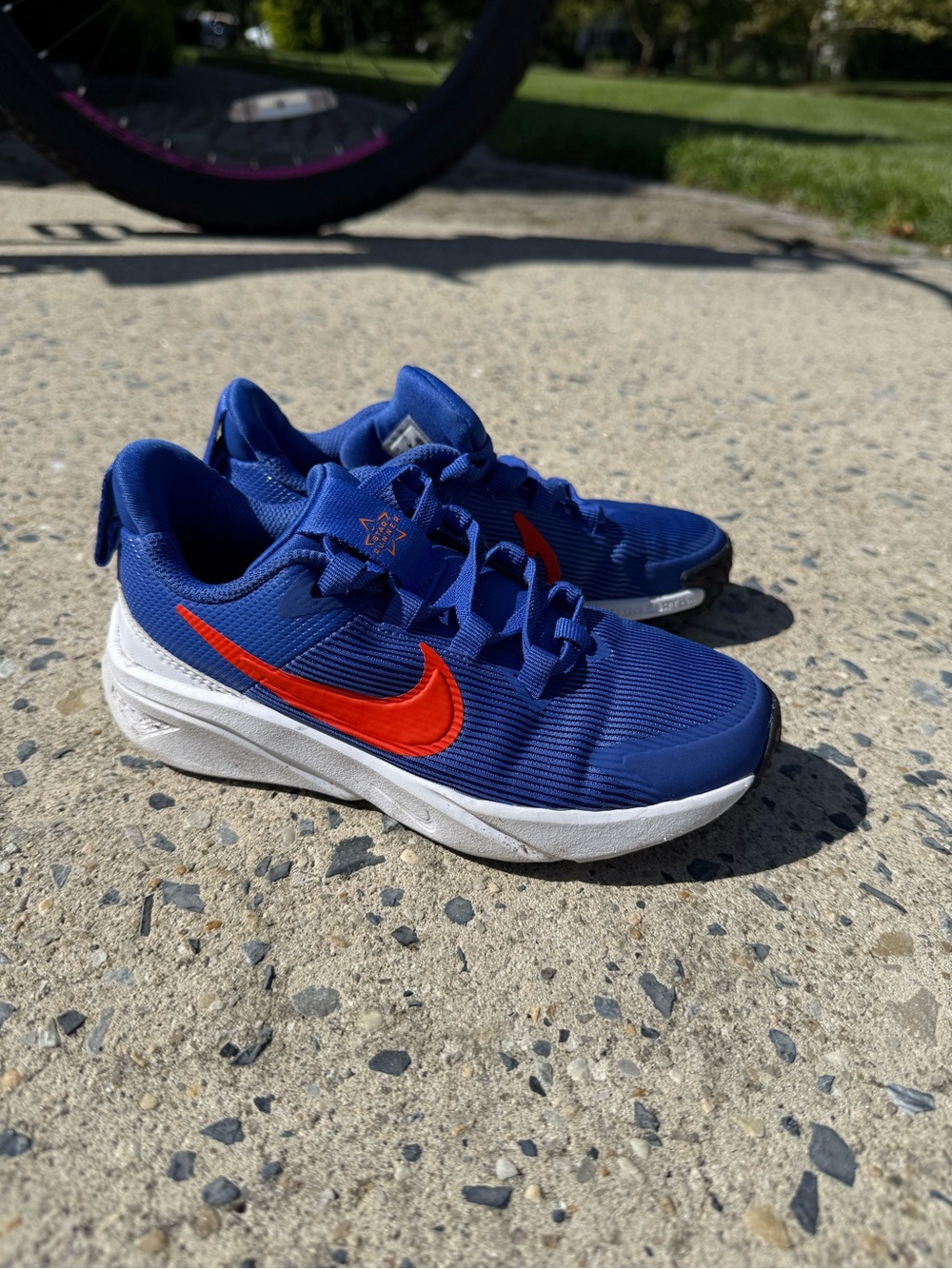 Nike Kids Blue Sneakers with Red Swoosh and White Sole